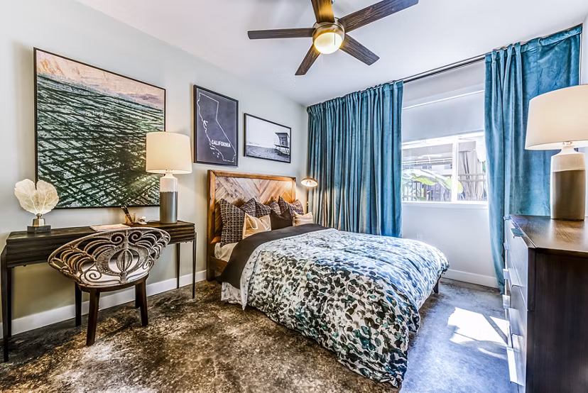 Cozy bedroom with modern decor at Luce Apartments, a luxury Greystar community