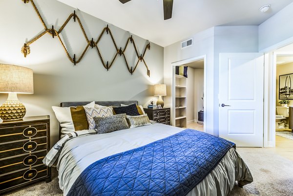 Cozy bedroom with modern decor at Luce Apartments in luxury Greystar community