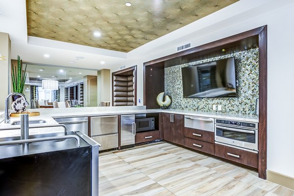 Contemporary clubhouse with stylish bar and modern kitchen at Luce Apartments