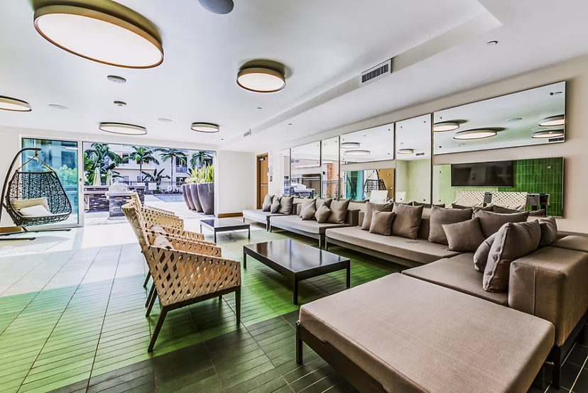 Luce Apartments: Modern patio and vibrant game room offering entertainment in a luxurious setting