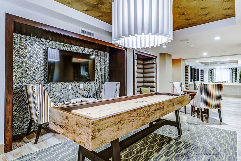 Game room featuring billiards and gaming consoles at Luce Apartments
