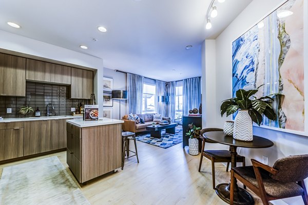 Luce Apartments: Elegant dining room with modern decor and ample natural light