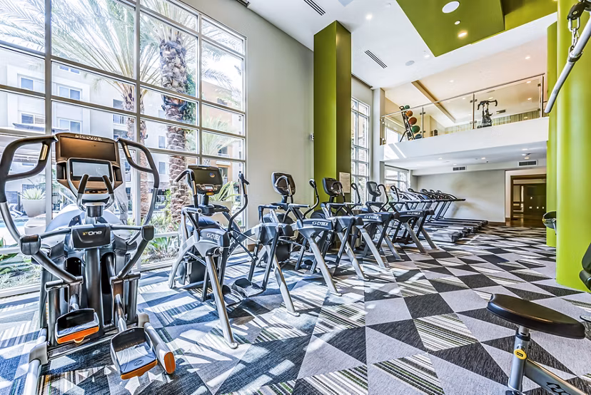 Modern fitness center equipped with state-of-the-art machines at Luce Apartments
