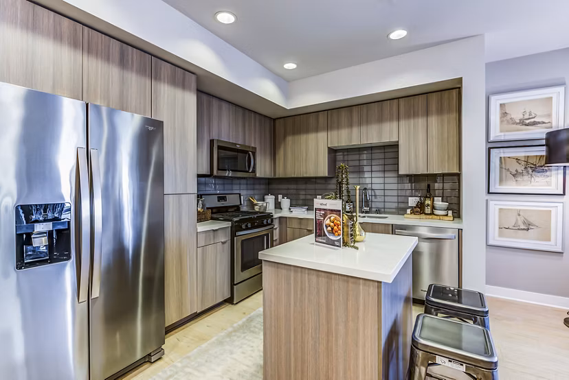Modern kitchen featuring sleek cabinetry and stainless steel appliances at Luce Apartments