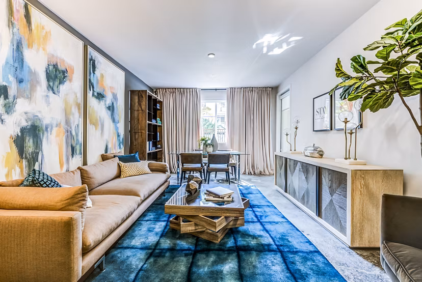 Spacious living room with modern design and chic decor at Luce Apartments, offering luxury urban living