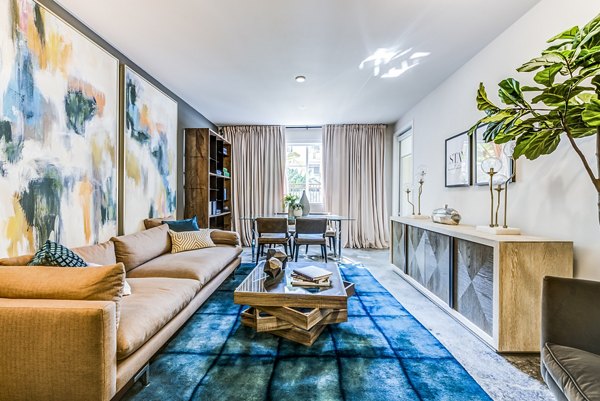 Spacious living room with modern design and chic decor at Luce Apartments, offering luxury urban living