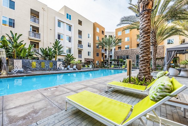 Rooftop pool with lounge chairs at Luce Apartments, a luxury community by Greystar