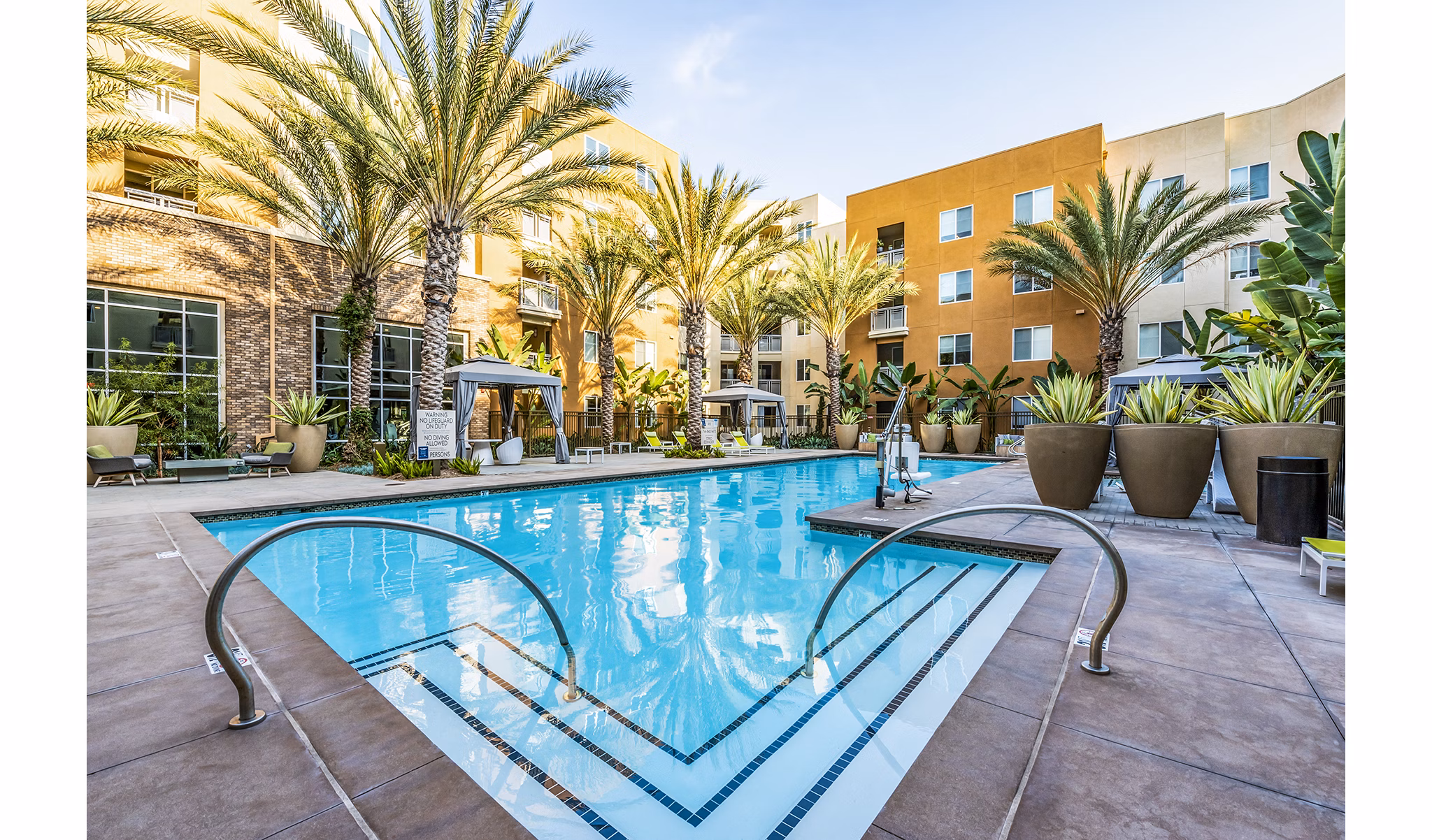 Luxurious outdoor pool at Luce Apartments with sleek lounging areas near Greystar's premier locations