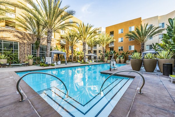 Luxurious outdoor pool at Luce Apartments with sleek lounging areas near Greystar's premier locations