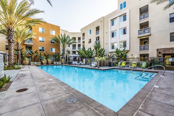 Resort-style swimming pool at Luce Apartments in a luxurious setting, perfect for relaxation and leisure activities
