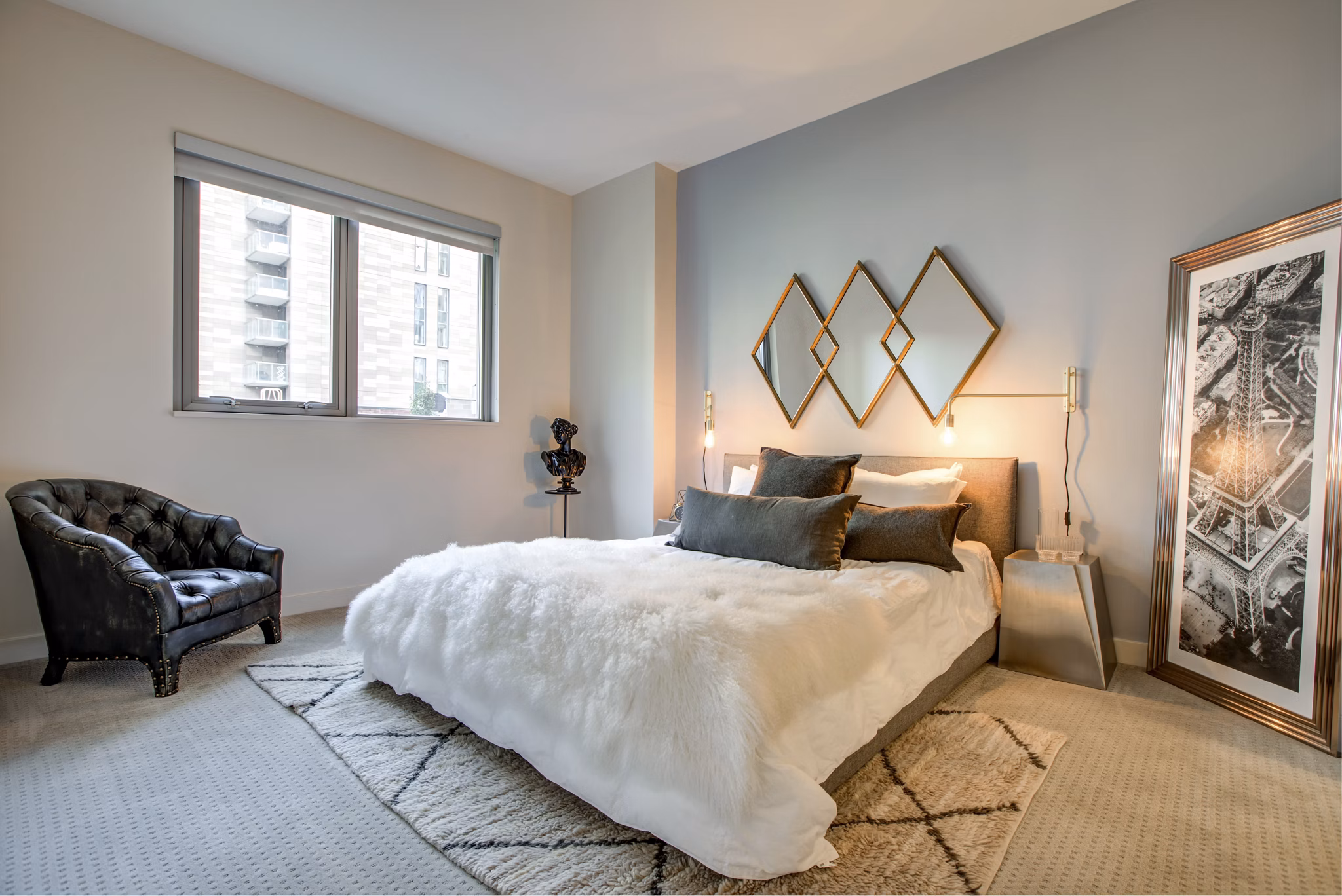 Cozy bedroom with modern furnishings at Argenta Apartments, featuring plush bedding and stylish decor