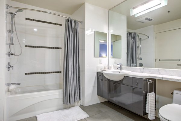 Modern bathroom with sleek fixtures at Argenta Apartments: luxury living in the heart of the city