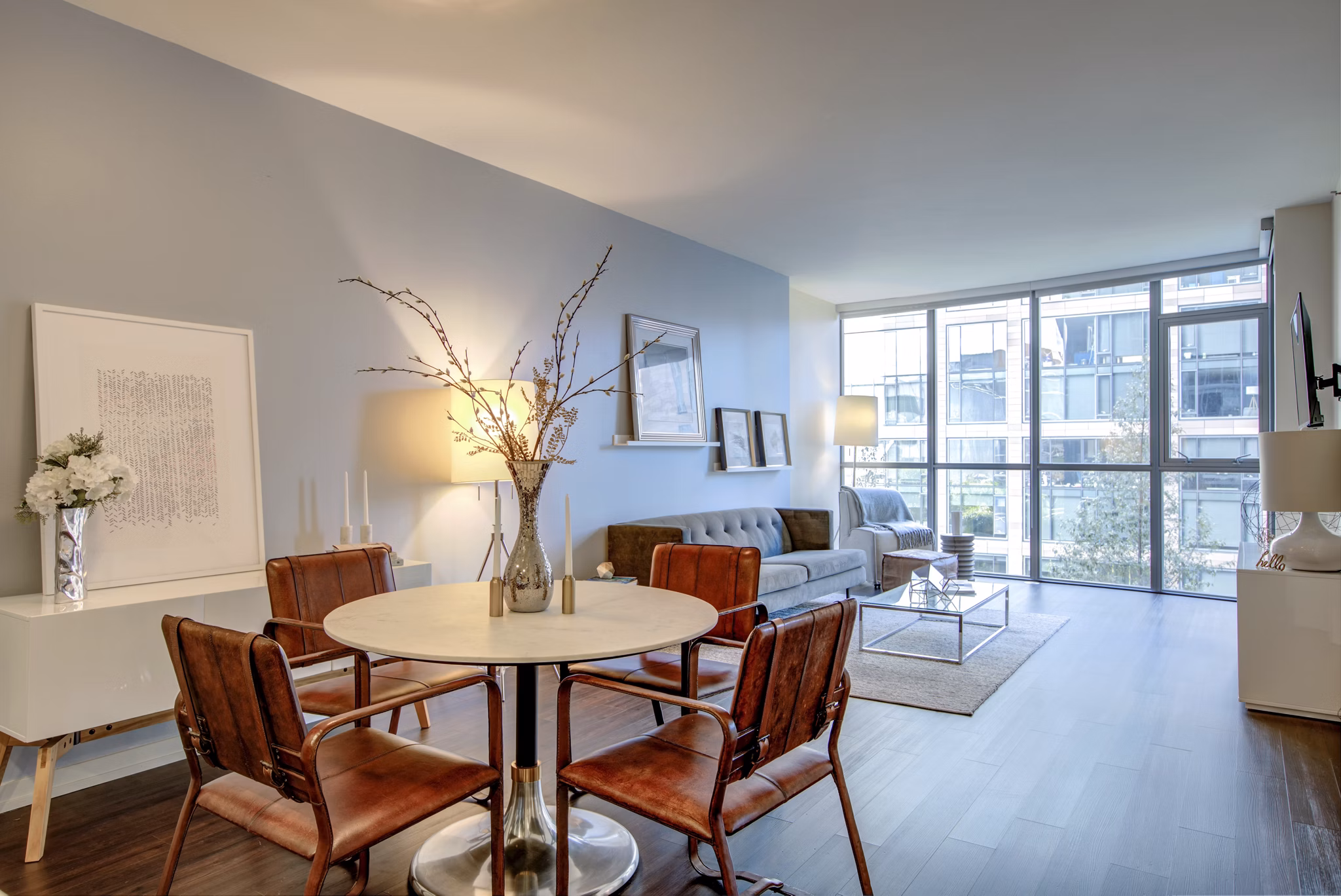 Elegant dining area with contemporary furnishings at Argenta Apartments, showcasing modern luxury living in the heart of the city