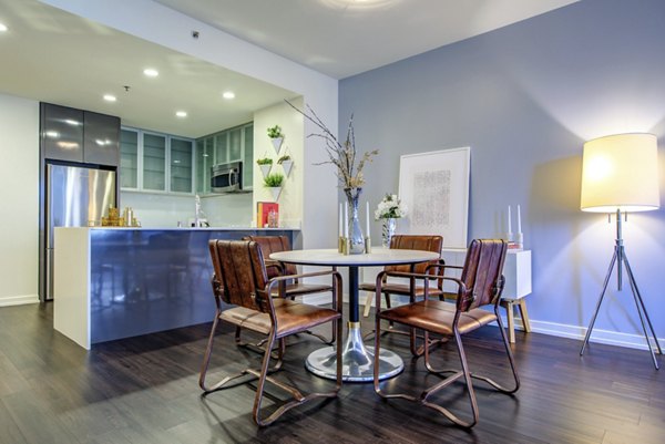 Dining area with modern furnishings at Argenta Apartments, luxury Greystar property