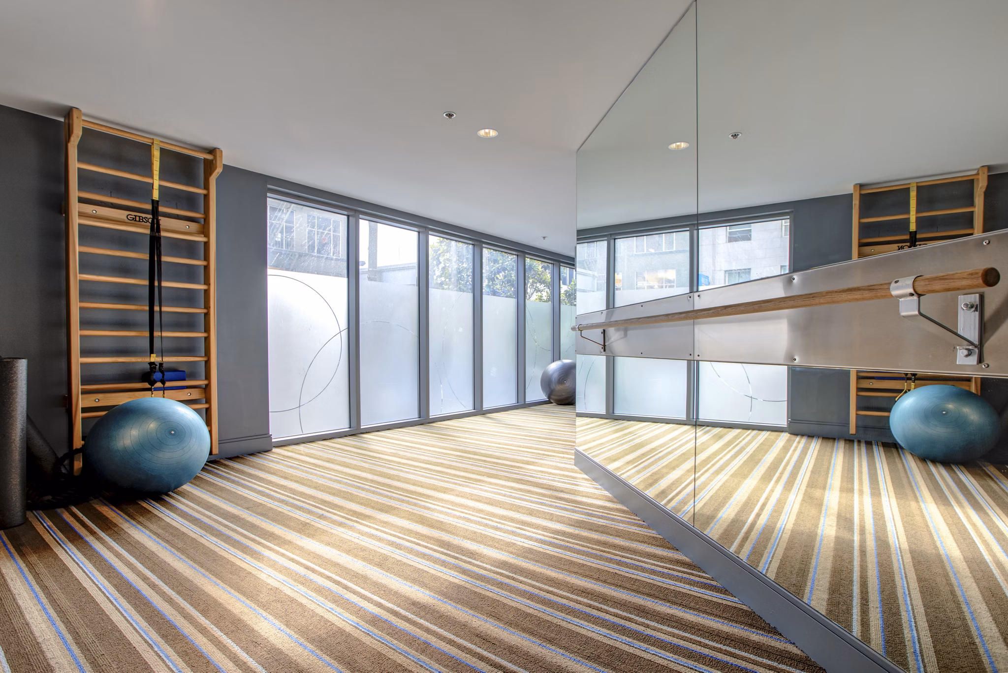 State-of-the-art fitness center with modern equipment at Argenta Apartments, offering a premium lifestyle experience