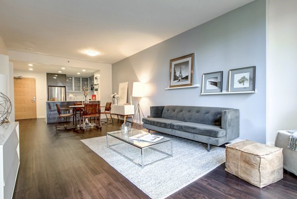 Modern living room with stylish furniture and natural light at Argenta Apartments