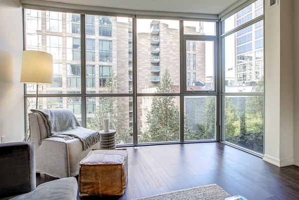 Modern living room with chic decor at Argenta Apartments: luxury rental by Greystar in the heart of the city