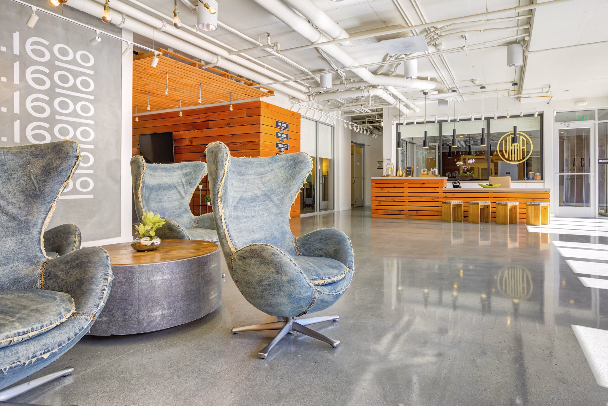 Stylish clubhouse with modern furnishings at Vara Apartments, a Greystar luxury property in downtown location