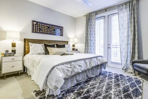 Elegant bedroom with contemporary design and spacious layout at Overture Arboretum Apartments