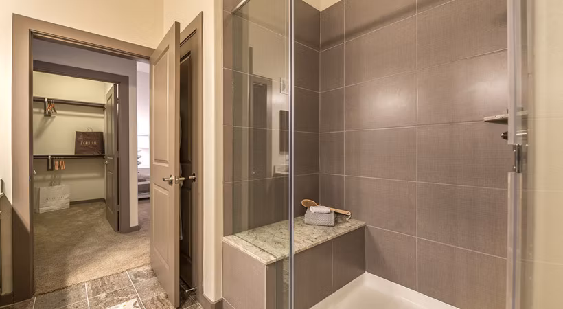 Elegant bathroom with sleek fixtures and marble countertops at Overture Arboretum Apartments