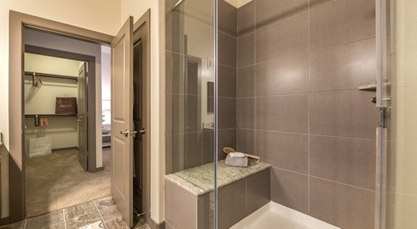 Elegant bathroom with sleek fixtures and marble countertops at Overture Arboretum Apartments