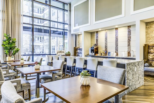 Clubhouse kitchen with elegant dining area at Overture Arboretum Apartments