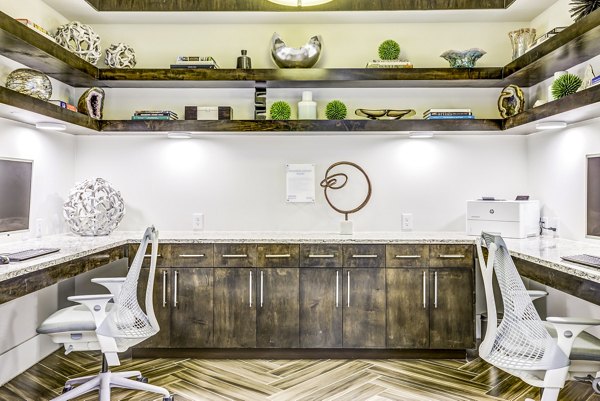 Business center with modern furnishings at Overture Arboretum Apartments clubhouse