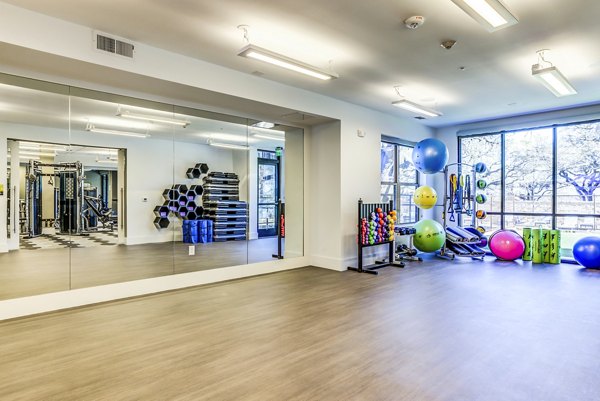 State-of-the-art fitness center with modern equipment at Overture Arboretum Apartments for an active lifestyle experience