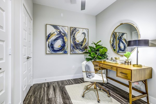 Home office with modern decor in Overture Arboretum Apartments, ideal space for remote work in luxury living environment