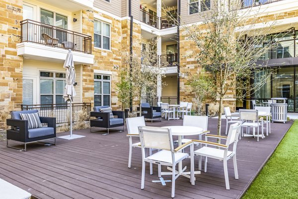 Spacious outdoor patio with comfortable seating at Overture Arboretum Apartments