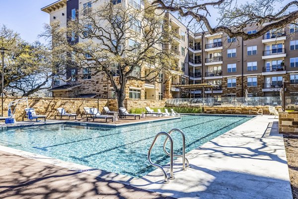 Luxury pool with resort-style seating at Overture Arboretum Apartments