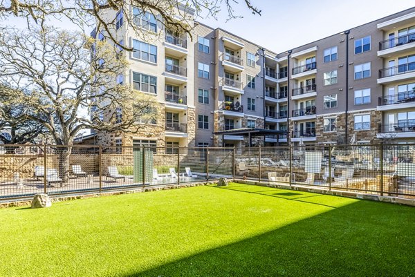 Dog park with agility equipment at Overture Arboretum Apartments