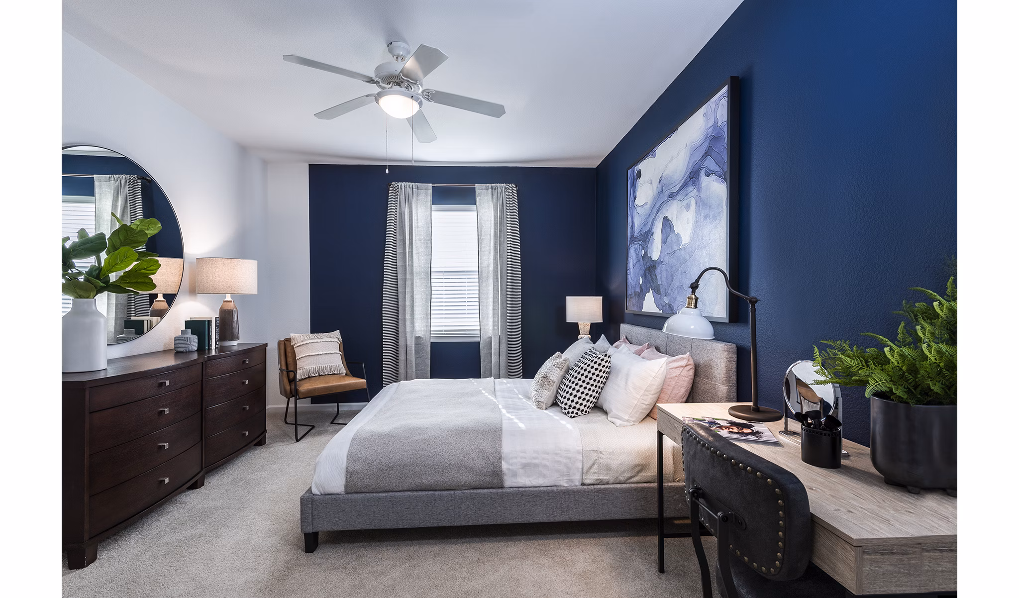 Comfortable bedroom featuring modern decor in Baileys Crossing apartments, renovated in 2018