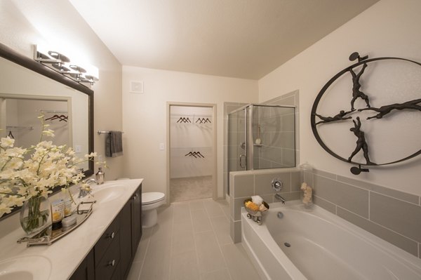 Modern bathroom with sleek fixtures at Bailey's Crossing Apartments offers a luxurious experience with premium amenities in a stylish setting