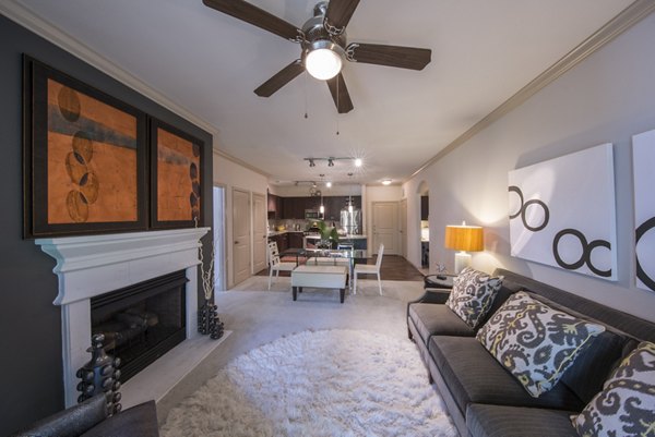 Spacious living room with modern furnishings in Bailey's Crossing Apartments, ideal for luxury living near urban amenities and attractions