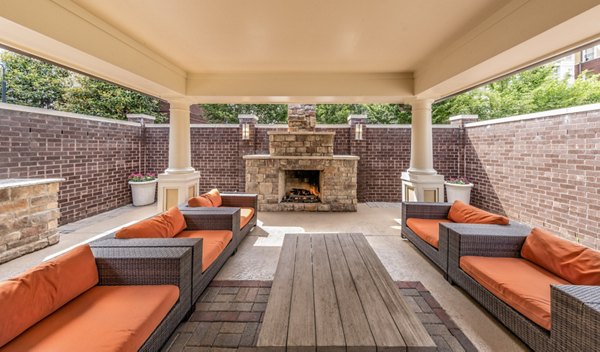 Cozy fire pit area at Bailey's Crossing Apartments, perfect for social gatherings and relaxing evenings outdoors
