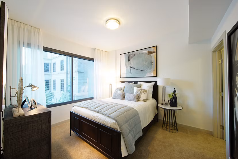 Cozy bedroom with modern decor at Cyan on Peachtree Apartments