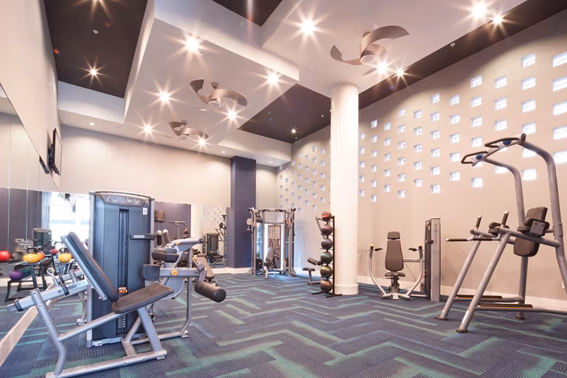 State-of-the-art fitness center with modern equipment at Cyan on Peachtree Apartments offering a luxurious workout experience