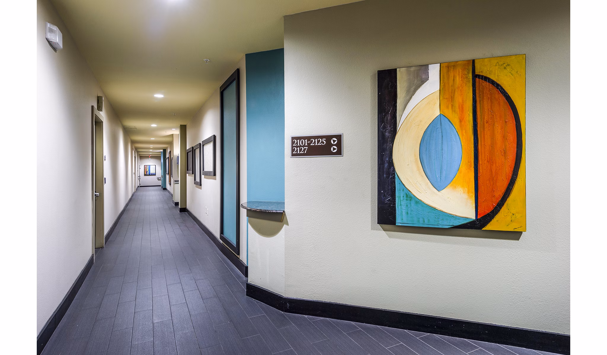 Spacious hallway with modern lighting at Allegro Apartments