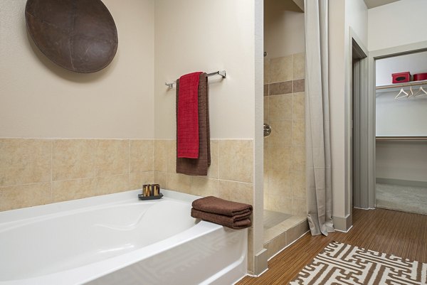 Allegro Apartments: Modern bathroom featuring elegant fixtures and sleek tile design