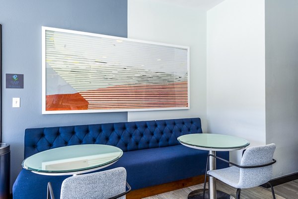 Modern clubhouse with cozy seating and vibrant decor at Allegro Apartments, offering premium amenities for residents in luxury living