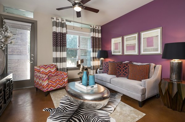 Living room at Allegro Apartments: Elegant space with contemporary furniture and natural light
