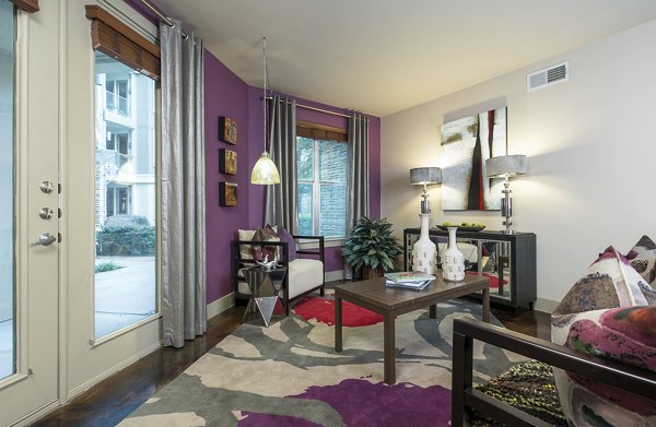 Spacious living room with modern decor in Allegro Apartments offering luxury living in a vibrant community