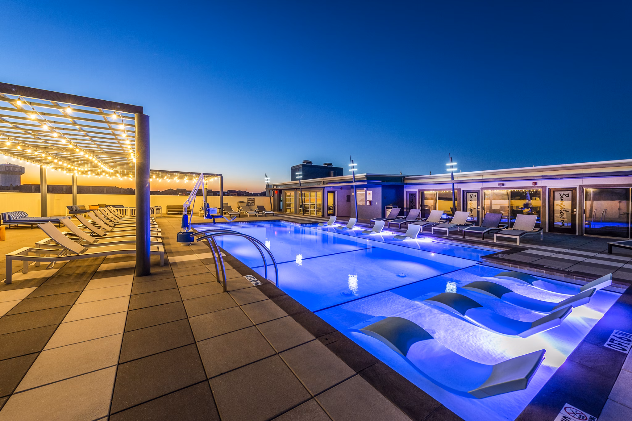 Outdoor pool at Allegro Apartments offering relaxation and socializing spaces Enjoy luxury amenities in a Greystar-managed community
