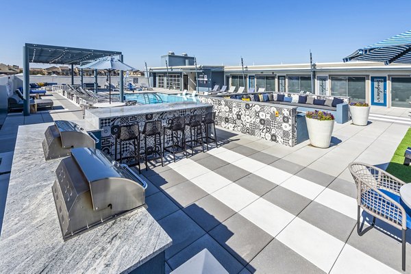 Outdoor barbecue area with modern grills at Allegro Apartments, Greystar luxury community