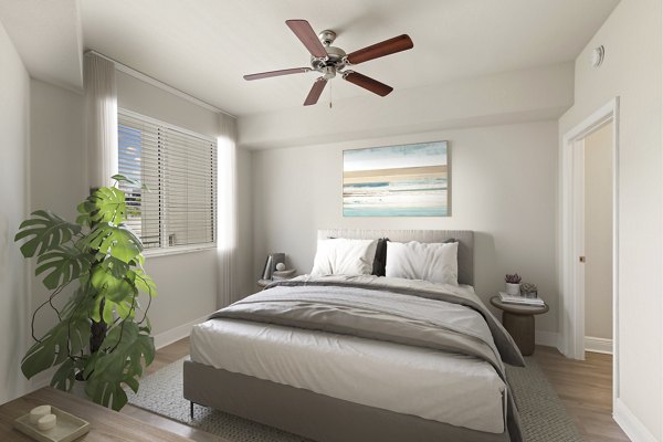 Modern bedroom with stylish furnishings at SoMa at Brickell Apartments