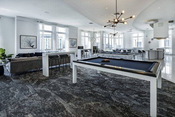 Modern clubhouse with stylish decor at SoMa at Brickell Apartments, featuring luxurious seating and entertainment areas