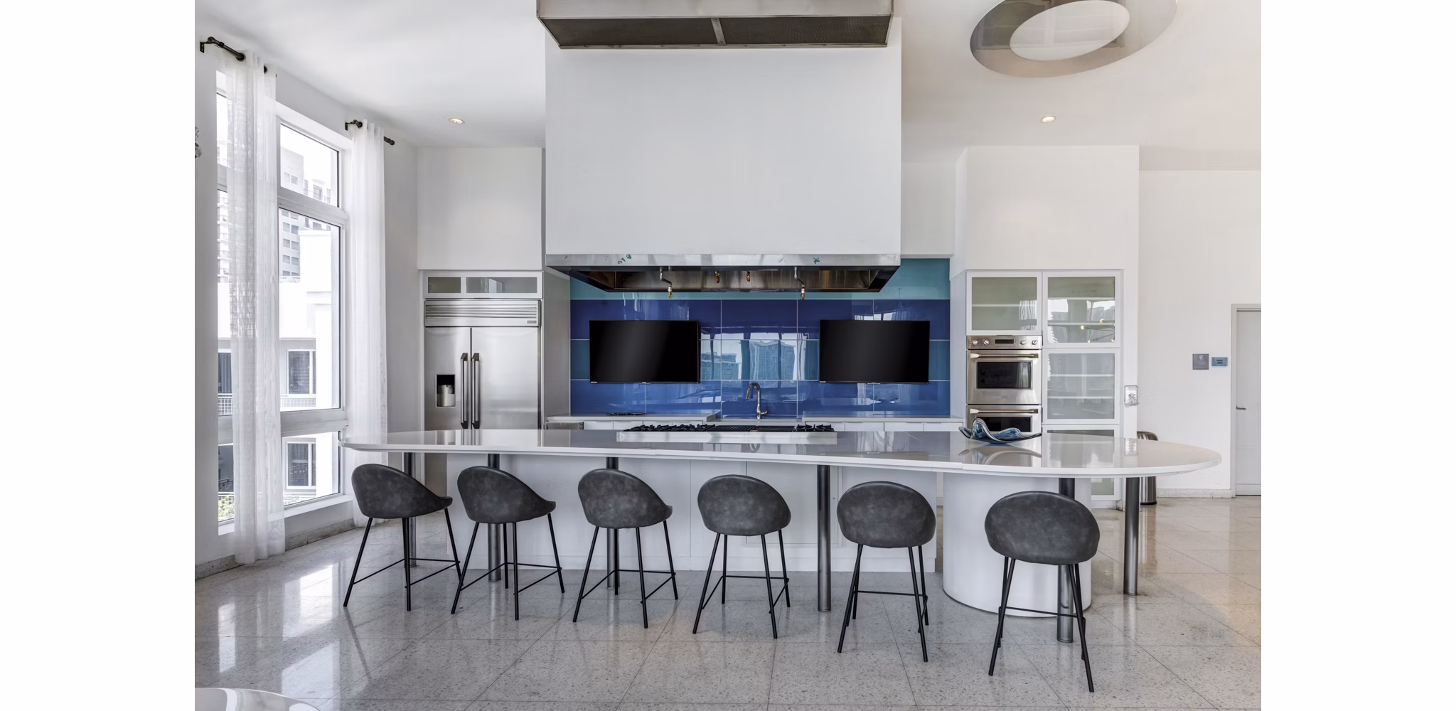 Clubhouse at SoMa at Brickell Apartments featuring modern design and luxurious seating areas for resident gatherings and events in Miami