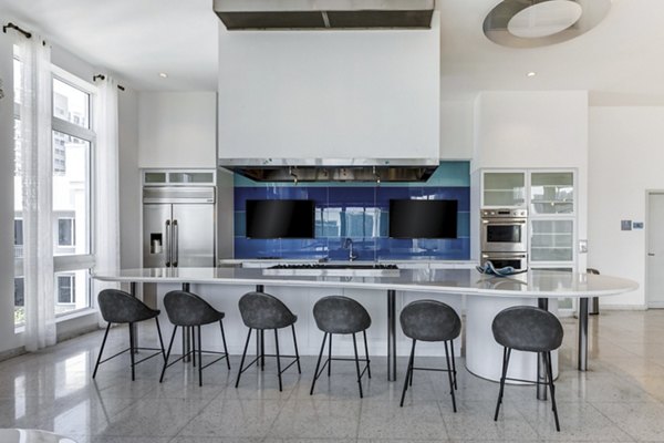 Clubhouse at SoMa at Brickell Apartments featuring modern design and luxurious seating areas for resident gatherings and events in Miami