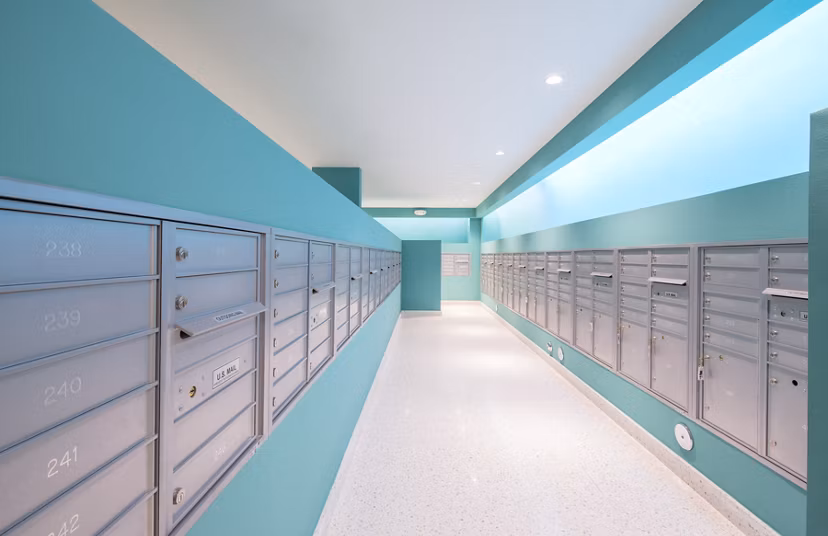 Modern mail room featuring secure package lockers at SoMa at Brickell Apartments